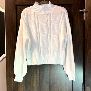 Never worn sweater. Size is an XL, but it does not fits like a large.